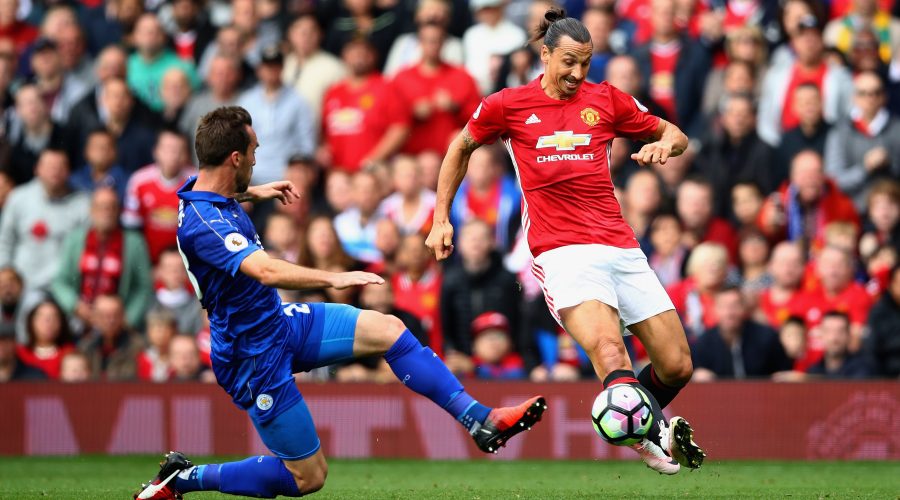 MANCHESTER, ENGLAND - SEPTEMBER 24: Christian Fuchs of Leicester City (L) attempts to block Zlatan Ibrahimovic of Manchester United (R) cross  during the Premier League match between Manchester United and Leicester City at Old Trafford on September 24, 2016 in Manchester, England.  (Photo by Clive Brunskill/Getty Images)