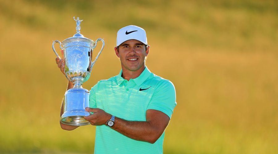 HARTFORD, WI - JUNE 18:  Brooks Koepka of the United States poses with the winner's trophy after his victory at the 2017 U.S. Open at Erin Hills on June 18, 2017 in Hartford, Wisconsin.  (Photo by Richard Heathcote/Getty Images)