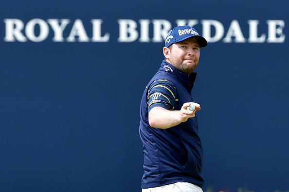 SOUTHPORT, ENGLAND - JULY 22:  Branden Grace of South Africa acknowledges the crowd on the 18th green after shooting a 62, the lowest round in major history during the third round of the 146th Open Championship at Royal Birkdale on July 22, 2017 in Southport, England.  (Photo by Stuart Franklin/Getty Images)