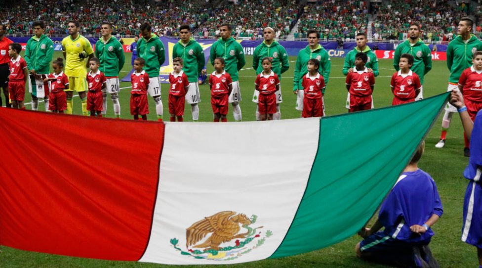 SAN ANTONIO,TX - JULY 16: Team Mexico poses in front of their flag before the game against Curaco during the 2017 CONCACAF Gold Cup at Alamodome on July 16, 2017 in San Antonio,Texas.  (Photo by Ronald Cortes/Getty Images) *** local caption ***
