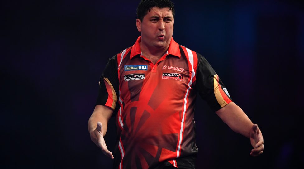 LONDON, ENGLAND - DECEMBER 21:  Mensur Suljovic of Serbia reacts during his first round match against Ron Meulenkamp of the Netherlands on day seven of the 2017 William Hill PDC World Darts Championships at Alexandra Palace on December 21, 2016 in London, England. (Photo by Dan Mullan/Getty Images)