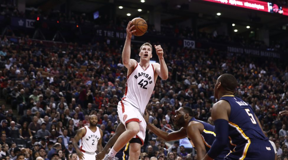 TORONTO, ONTARIO - MARCH 19:  Jakob Poeltl #42 of the Toronto Raptors drives to the basket against the Indiana Pacers on March 19, 2017 at Air Canada Centre in Toronto, Ontario, Canada. NOTE TO USER: User expressly acknowledges and agrees that, by downloading and/or using this Photograph, user is consenting to the terms and conditions of the Getty Images License Agreement. Mandatory Copyright Notice: Copyright 2017 NBAE (Photo by Mark Blinch/NBAE via Getty Images)