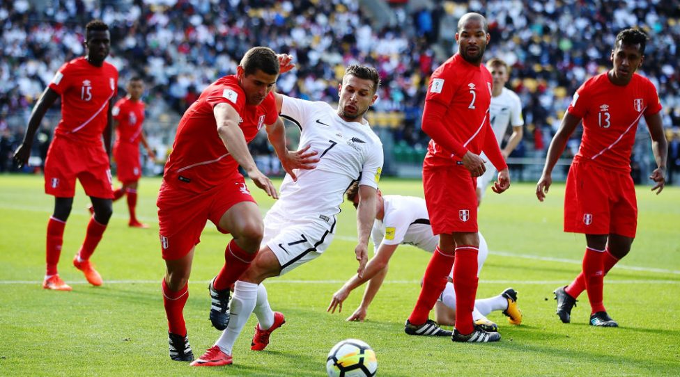 WELLINGTON, NEW ZEALAND - NOVEMBER 11:  Aldo Corzo of Peru competes with Kosta Barbarouses of the All Whites for the ball during the 2018 FIFA World Cup Qualifier match between the New Zealand All Whites and Peru at Westpac Stadium on November 11, 2017 in Wellington, New Zealand.  (Photo by Hannah Peters/Getty Images)