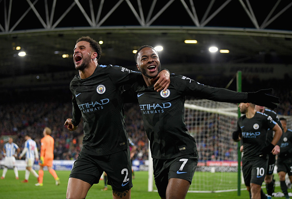 HUDDERSFIELD, ENGLAND - NOVEMBER 26:  Raheem Sterling of Manchester City celebrates scoring the 2nd Manchester City goal with Kyle Walker of Manchester City  during the Premier League match between Huddersfield Town and Manchester City at John Smith's Stadium on November 26, 2017 in Huddersfield, England.  (Photo by Shaun Botterill/Getty Images)