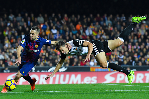 VALENCIA, SPAIN - NOVEMBER 26:Jordi Alba of FC Barcelona competes for the ball with Gabriel Paulista of Valencia CF during the La Liga match between Valencia and Barcelona at Mestalla stadium on November 26, 2017 in Valencia, Spain.  (Photo by David Ramos/Getty Images)