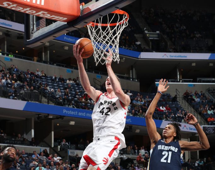 MEMPHIS, TN - DECEMBER 8:  Jakob Poeltl #42 of the Toronto Raptors handles the ball against the Memphis Grizzlies on December 8, 2017 at FedExForum in Memphis, Tennessee. NOTE TO USER: User expressly acknowledges and agrees that, by downloading and or using this photograph, User is consenting to the terms and conditions of the Getty Images License Agreement. Mandatory Copyright Notice: Copyright 2017 NBAE (Photo by Joe Murphy/NBAE via Getty Images)
