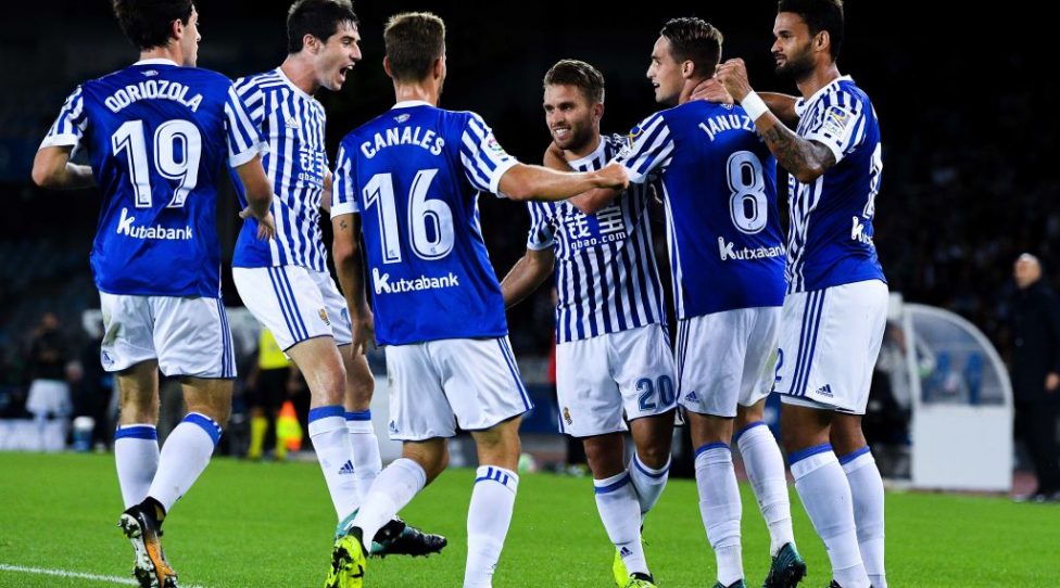 SAN SEBASTIAN, SPAIN - SEPTEMBER 17:  Kevin Rodrigues of Real Sociedad de Futbol (C) celebrates with his team  mates after scoring his team's first goal during the La Liga match between Real Sociedad and Real Madrid at Anoeta stadium on September 17, 2017 in San Sebastian, Spain.  (Photo by David Ramos/Getty Images)