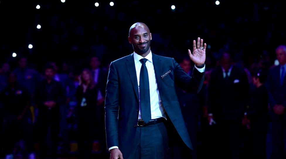 LOS ANGELES, CA - DECEMBER 18:  Kobe Bryant smiles at halftime as both his #8 and #24 Los Angeles Lakers jerseys are retired at Staples Center on December 18, 2017 in Los Angeles, California. NOTE TO USER: User expressly acknowledges and agrees that, by downloading and or using this photograph, User is consenting to the terms and conditions of the Getty Images License Agreement.  (Photo by Harry How/Getty Images)