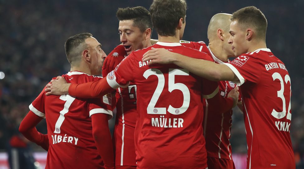 MUNICH, GERMANY - FEBRUARY 10: Robert Lewandowski of Bayern Muenchen (2nd left) celebrates with his team after he scored to make it 1:0 during the Bundesliga match between FC Bayern Muenchen and FC Schalke 04 at Allianz Arena on February 10, 2018 in Munich, Germany. (Photo by Alex Grimm/Bongarts/Getty Images)