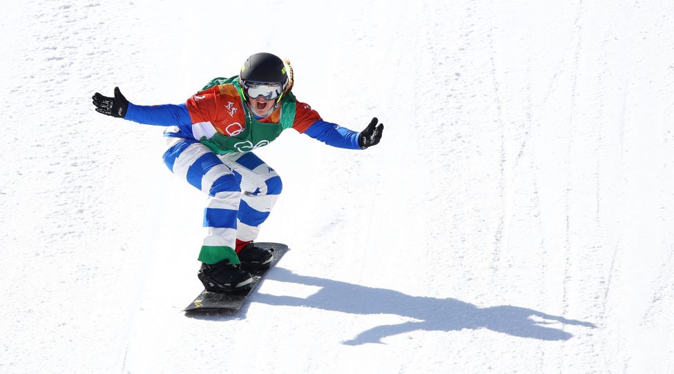 PYEONGCHANG-GUN, SOUTH KOREA - FEBRUARY 16:  Michela Moioli of Italy (green) celebrates winning gold in the Ladies' Snowboard Cross Big Final on day seven of the PyeongChang 2018 Winter Olympic Games at Phoenix Snow Park on February 16, 2018 in Pyeongchang-gun, South Korea.  (Photo by Cameron Spencer/Getty Images)