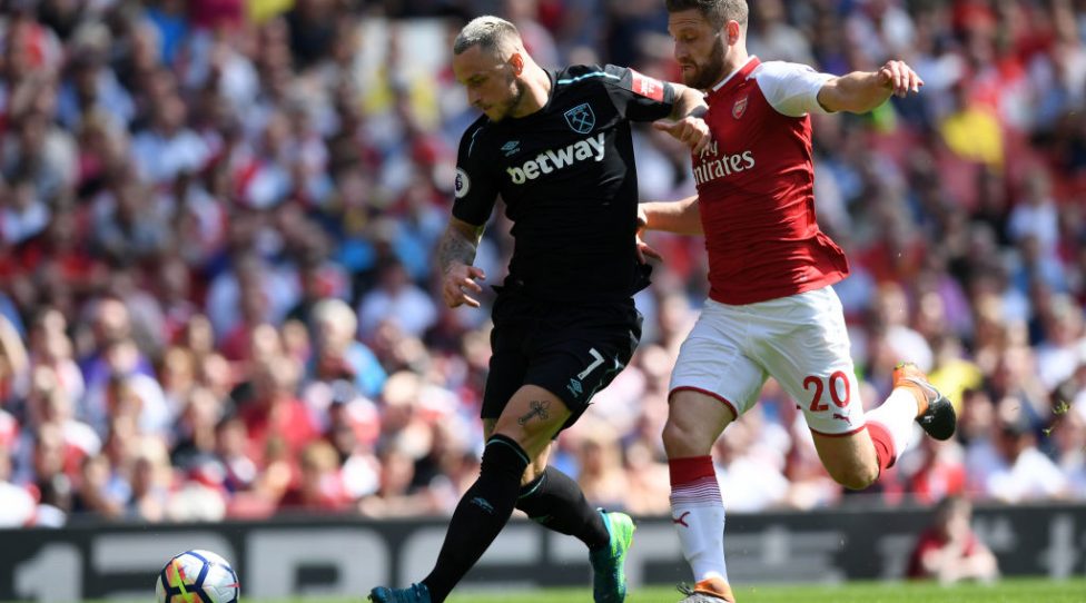 LONDON, ENGLAND - APRIL 22:  Shkodran Mustafi of Arsenal and Marko Arnautovic of West Ham United battle for possession during the Premier League match between Arsenal and West Ham United at Emirates Stadium on April 22, 2018 in London, England.  (Photo by Shaun Botterill/Getty Images)