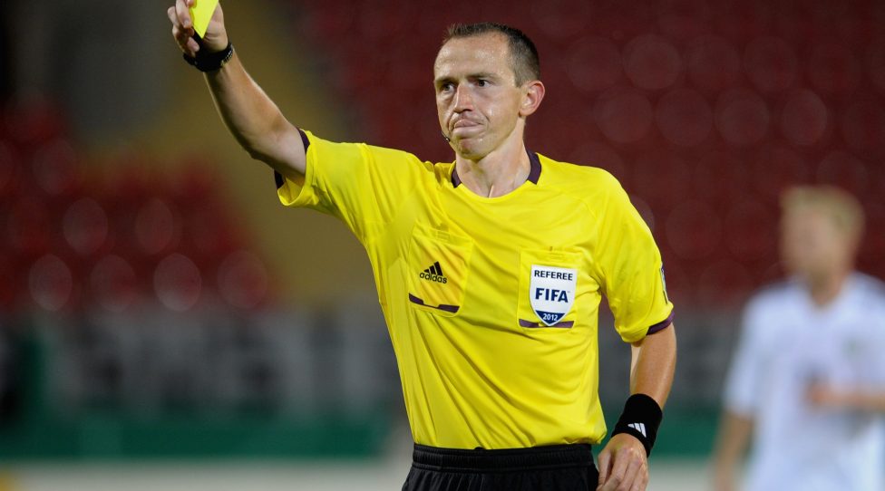 OFFENBACH, GERMANY - AUGUST 14:  Referee Ruddy Buquet shows a yellow card during the Under 21 international friendly match between Germany U21 and Argentina U21 at Sparda-Bank-Hessen-Stadion on August 14, 2012 in Offenbach, Germany.  (Photo by Dennis Grombkowski/Bongarts/Getty Images)