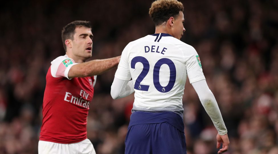 LONDON, ENGLAND - DECEMBER 19:  Dele Alli of Tottenham Hotspur looks towards the fans after being hit by a water bottle during the Carabao Cup Quarter Final match between Arsenal and Tottenham Hotspur at Emirates Stadium on December 19, 2018 in London, United Kingdom.  (Photo by Alex Morton/Getty Images)
