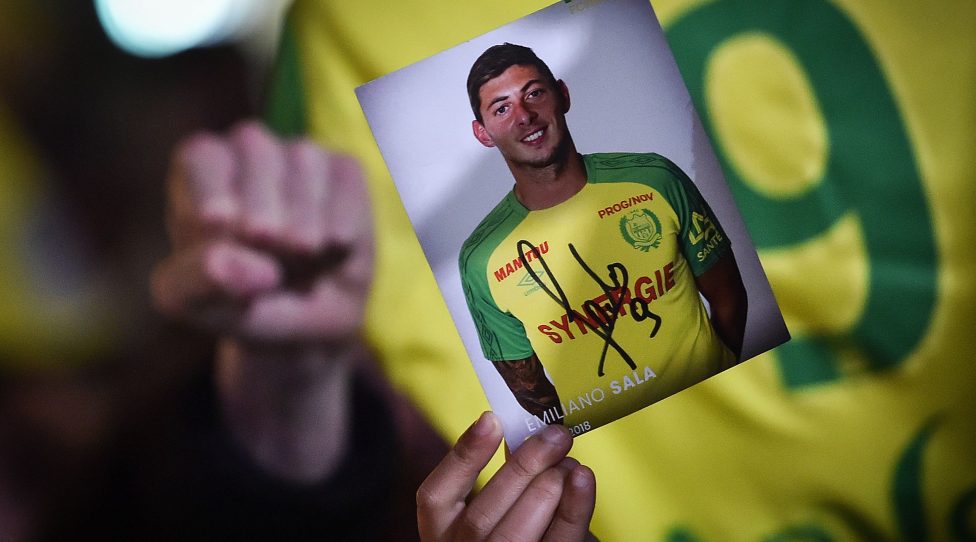 TOPSHOT - FC Nantes football club supporters gather in Nantes after it was announced that the plane Argentinian forward Emiliano Sala was flying in vanished during a flight from Nantes in western France to Cardiff in Wales, in January 22, 2019. - The 28-year-old Argentine striker is one of two people still missing after contact was lost with the light aircraft he was travelling in on January 21, 2019 night. Sala was on his way to the Welsh capital to train with his new teammates for the first time after completing a £15 million ($19 million) move to Cardiff City from French side Nantes on January 19. (Photo by LOIC VENANCE / AFP)        (Photo credit should read LOIC VENANCE/AFP/Getty Images)