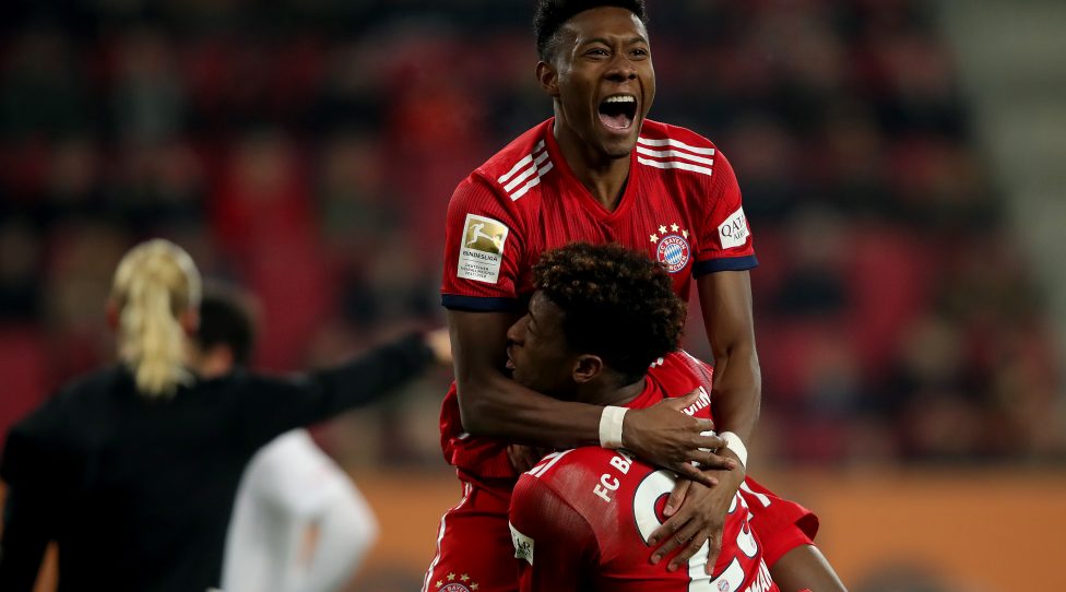 AUGSBURG, GERMANY - FEBRUARY 15: David Alaba (L) of Muenchen celebrate with team mate Kingsley Coman after he scores the 3rd goal during the Bundesliga match between FC Augsburg and FC Bayern Muenchen at WWK-Arena on February 15, 2019 in Augsburg, Germany. (Photo by Alexander Hassenstein/Bongarts/Getty Images)
