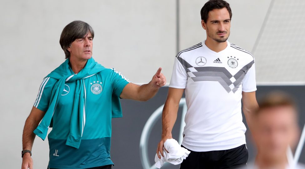 MUNICH, GERMANY - SEPTEMBER 04:  Joachim Loew, head coach of Germany reacts with his player Mats Hummels during a team Germany training session at Bayern Muenchen Campus on September 4, 2018 in Munich, Germany.  (Photo by Alexander Hassenstein/Bongarts/Getty Images)