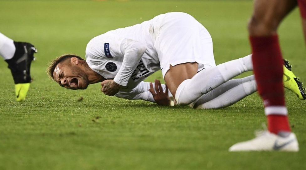 TOPSHOT - Paris Saint-Germain's Brazilian forward Neymar reacts after falling down on the football pitch during the UEFA Champions League Group C football match between Paris Saint-Germain (PSG) and Liverpool FC at the Parc des Princes stadium, in Paris, on November 28, 2018. (Photo by FRANCK FIFE / AFP)        (Photo credit should read FRANCK FIFE/AFP/Getty Images)