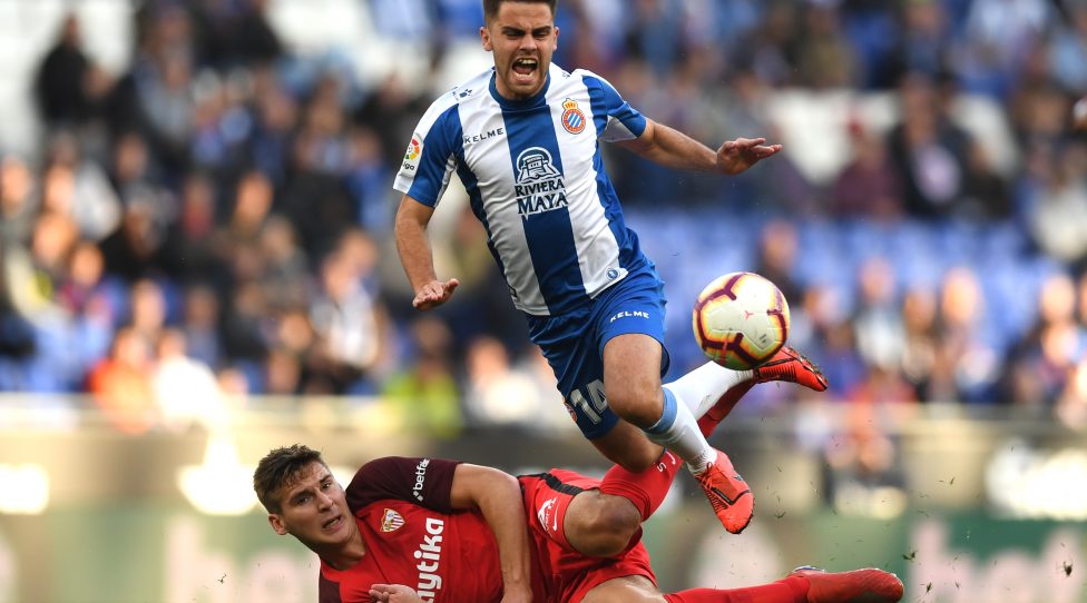 BARCELONA, SPAIN - MARCH 17:  Max Wober of Sevilla tackles Oscar Melendo of Espanyol during the La Liga match between RCD Espanyol and Sevilla FC at RCDE Stadium on March 17, 2019 in Barcelona, Spain. (Photo by Alex Caparros/Getty Images)