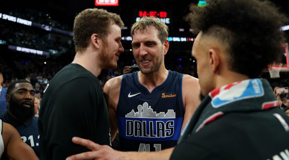 SAN ANTONIO, TX - APRIL 10: Dirk Nowitzki #41 of the Dallas Mavericks hi-fives Jakob Poeltl #25 of the San Antonio Spurs after the game on April 10, 2019 at the AT&T Center in San Antonio, Texas. NOTE TO USER: User expressly acknowledges and agrees that, by downloading and or using this photograph, user is consenting to the terms and conditions of the Getty Images License Agreement. Mandatory Copyright Notice: Copyright 2019 NBAE (Photos by Darren Carroll/NBAE via Getty Images)