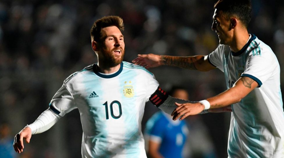 Argentina's Lionel Messi (L) celebrates with teammate Matias Suarez after scoring against Nicaragua during their international friendly football match at the San Juan del Bicentenario stadium in San Juan, Argentina, on June 7, 2019. (Photo by Andres LARROVERE / AFP)        (Photo credit should read ANDRES LARROVERE/AFP/Getty Images)