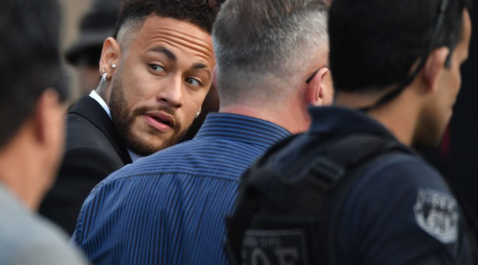 Brazilian football player Neymar (L) arrives at the Women's Defence Precinct in Sao Paulo, Brazil on June 13, 2019 to testify after Brazilian Najila Trindade filed a complaint against him on May 31, saying he assaulted her after inviting her to visit him in Paris. - Brazilian police said on Thursday they had filed a defamation suit against the woman who has accused football star Neymar of rape, after she insinuated the force was corrupt. (Photo by Nelson ALMEIDA / AFP)        (Photo credit should read NELSON ALMEIDA/AFP/Getty Images)