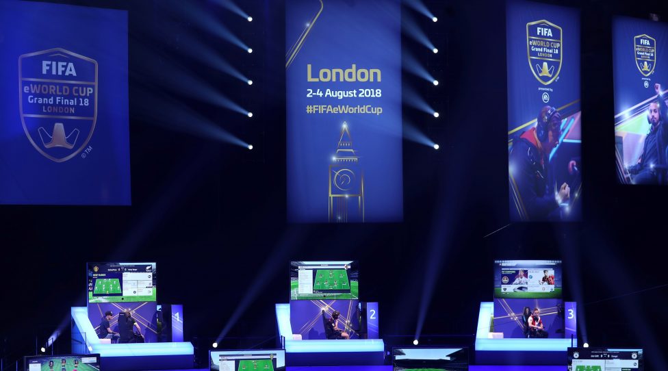 Players compete on Microsoft Xbox and Sony Playstation games consoles in the group stages of the FIFA eWorld Cup Grand Final, at the O2 in London on August 2, 2018. - The FIFA eWorld Cup Grand Final 2018 will see 32 finalists battle it out for the main prize  the title of FIFA eWorld Cup champion, and pocket USD 250,000 in prize money. (Photo by Daniel LEAL-OLIVAS / AFP)        (Photo credit should read DANIEL LEAL-OLIVAS/AFP/Getty Images)