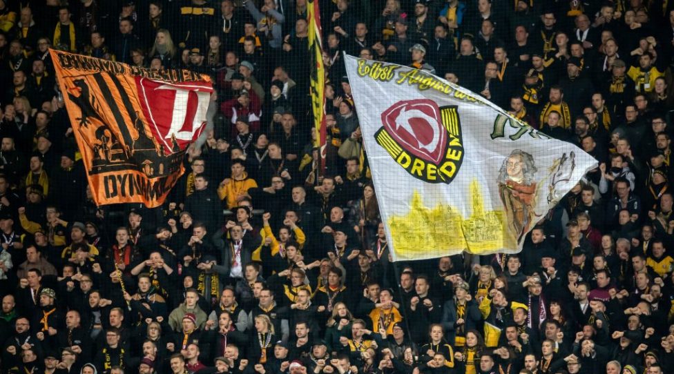 AUE, GERMANY - APRIL 01: Fans of Dresden support their team during the Second Bundesliga match between FC Erzgebirge Aue and SG Dynamo Dresden at Erzgebirgsstadion on April 01, 2019 in Aue, Germany. (Photo by Thomas Eisenhuth/Bongarts/Getty Images)