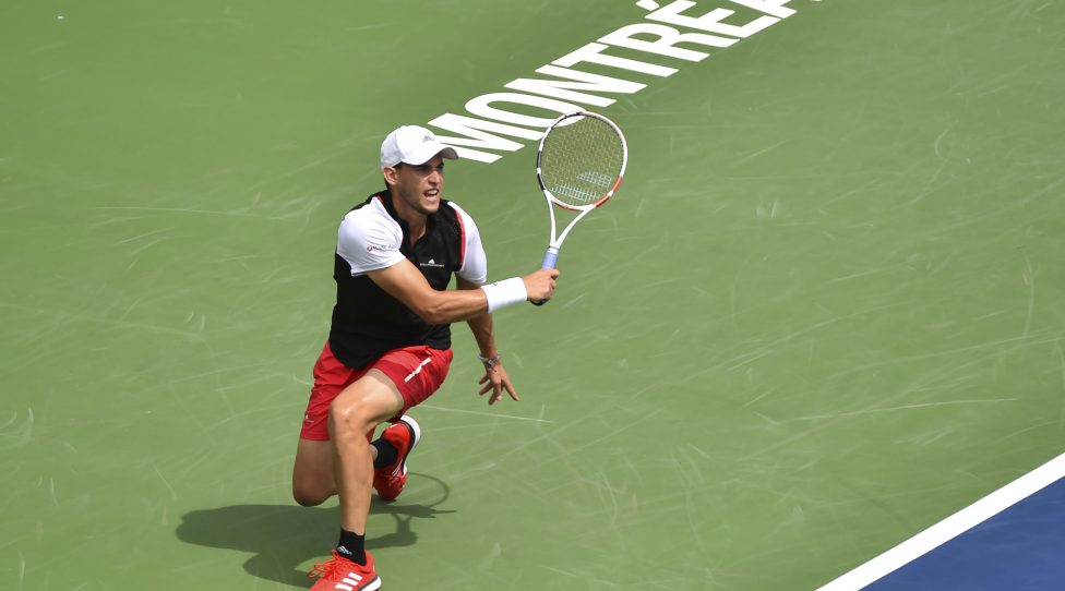 MONTREAL, QC - AUGUST 08:  Dominic Thiem of Austria returns the ball against Marin Cilic of Croatia during day 7 of the Rogers Cup at IGA Stadium on August 8, 2019 in Montreal, Quebec, Canada.  (Photo by Minas Panagiotakis/Getty Images)