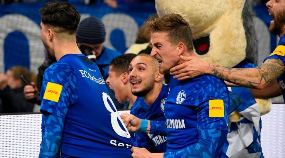Schalke's German midfielder Suat Serdar (L) celebrates with team mates (From L) Schalke's German midfielder Ahmed Kutucu, Schalke's German defender Bastian Oczipka and Schalke's Austrian forward Guido Burgstaller scoring the opening goal 1-0 during the German first division Bundesliga football match FC Schalke 04 vs FC Cologne in Gelsenkirchen, western Germany, on October 5, 2019. (Photo by INA FASSBENDER / AFP) / DFL REGULATIONS PROHIBIT ANY USE OF PHOTOGRAPHS AS IMAGE SEQUENCES AND/OR QUASI-VIDEO (Photo by INA FASSBENDER/AFP via Getty Images)