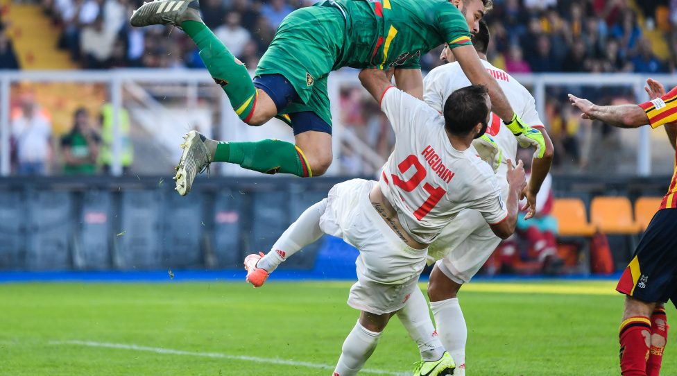 Juventus' Argentinian forward Gonzalo Higuain (Front) collides with Lecce's Brazilian goalkeeper Gabriel during the Italian Serie A footbal match Lecce vs Juventus on October 26, 2019 at the Stadio Comunlae Via del Mare in Lecce. (Photo by Alberto PIZZOLI / AFP) (Photo by ALBERTO PIZZOLI/AFP via Getty Images)