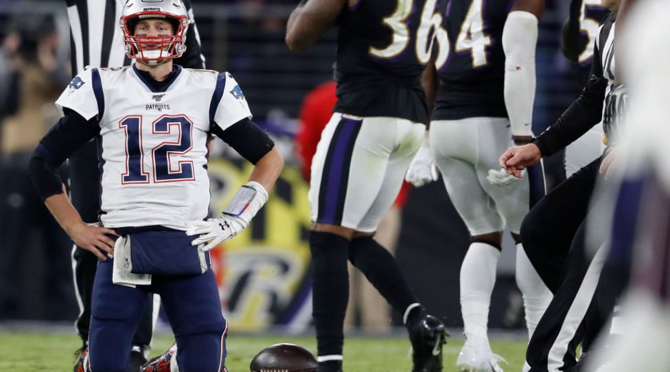 BALTIMORE, MARYLAND - NOVEMBER 03: Quarterback Tom Brady #12 of the New England Patriots reacts after being sacked against the Baltimore Ravens during the fourth quarter M&T Bank Stadium on November 3, 2019 in Baltimore, Maryland. (Photo by Scott Taetsch/Getty Images)