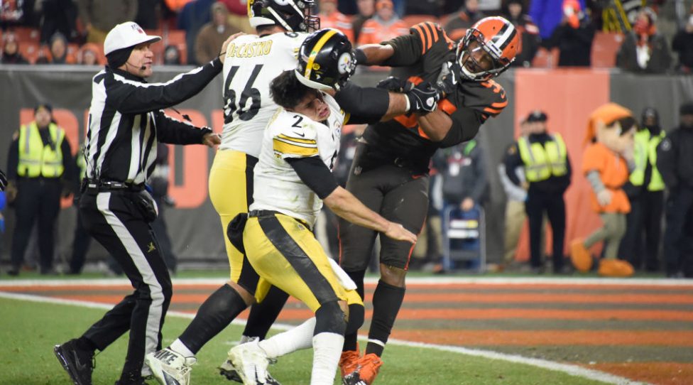 CLEVELAND, OHIO - NOVEMBER 14: Quarterback Mason Rudolph #2 of the Pittsburgh Steelers fights with defensive end Myles Garrett #95 of the Cleveland Browns during the second half at FirstEnergy Stadium on November 14, 2019 in Cleveland, Ohio. The Browns defeated the Steelers 21-7.  (Photo by Jason Miller/Getty Images)