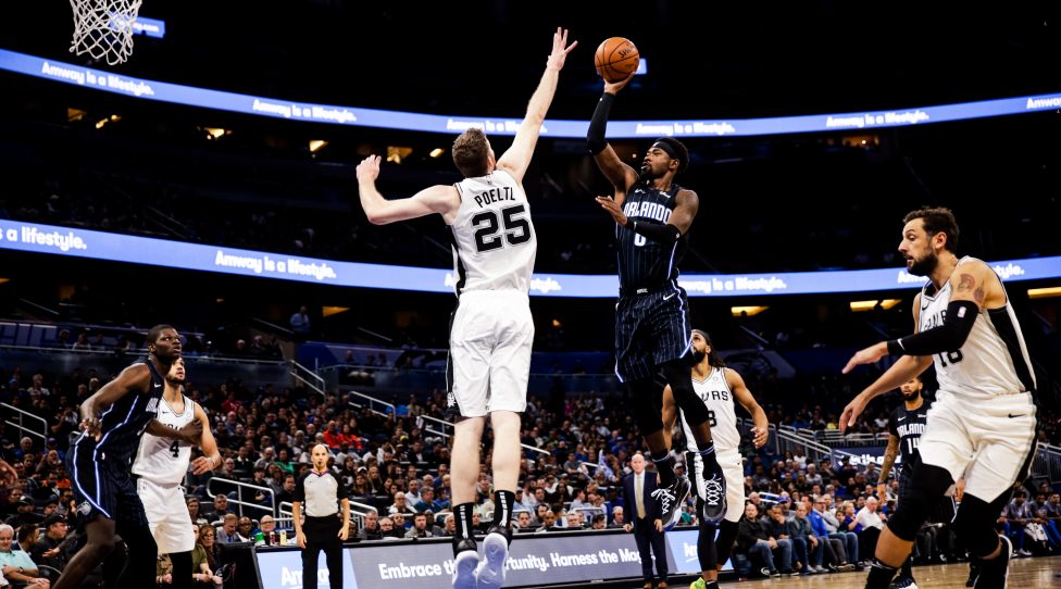 ORLANDO, FLORIDA - NOVEMBER 15: Terrence Ross #8 of the Orlando Magic takes a jump shot against Jakob Poeltl #25 of the San Antonio Spurs in the second quarter at Amway Center on November 15, 2019 in Orlando, Florida. NOTE TO USER: User expressly acknowledges and agrees that, by downloading and/or using this photograph, user is consenting to the terms and conditions of the Getty Images License Agreement. (Photo by Harry Aaron/Getty Images)