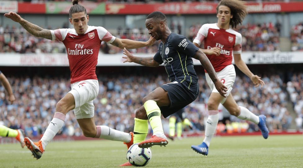 Raheem Sterling of Manchester City takes on Hector Bellerin and Matteo Guendouzi during the Arsenal v Manchester City F.A. Premier League match at the Emirates Stadium on August 12th 2018 in London (Photo by Tom Jenkins)