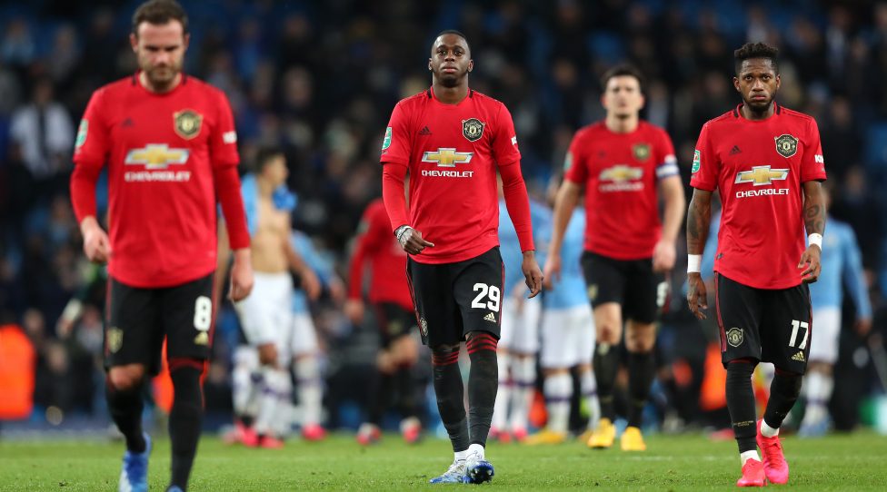 MANCHESTER, ENGLAND - JANUARY 29:  Aaron Wan-Bissaka of Manchester United along with team mates looks dejected after the Carabao Cup Semi Final match between Manchester City and Manchester United at Etihad Stadium on January 29, 2020 in Manchester, England. (Photo by Alex Livesey - Danehouse/Getty Images)