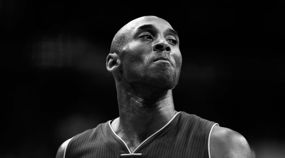 WASHINGTON, DC - DECEMBER 02: (Editors Note: Image has been converted to black and white) Kobe Bryant #24 of the Los Angeles Lakers looks on against the Washington Wizards in the first half at Verizon Center on December 2, 2015 in Washington, DC.  NOTE TO USER: User expressly acknowledges and agrees that, by downloading and or using this photograph, User is consenting to the terms and conditions of the Getty Images License Agreement.  (Photo by Rob Carr/Getty Images)