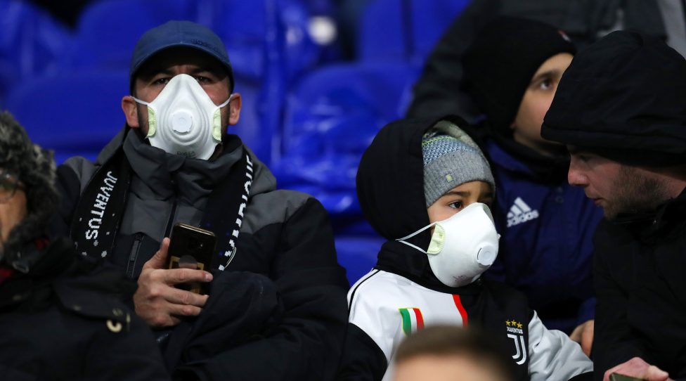 LYON, FRANCE - FEBRUARY 26: Fans wearing face masks during the UEFA Champions League round of 16 first leg match between Olympique Lyon and Juventus at Parc Olympique on February 26, 2020 in Lyon, France. (Photo by Catherine Ivill/Getty Images)