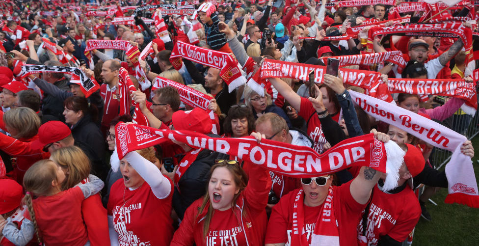 BERLIN, GERMANY - MAY 29: FC Union Berlin fans celebrate at their team's stadium, the Alte Försterei, in the Berlin district of Köpenick after the promotion of the team to the Bundesliga, on May 29, 2019 in Berlin, Germany. After defeating VfB Stuttgart in the relegation play-offs 1. FC Union Berlin won promotion to the Bundesliga for the first time in club history for the season 2019/2020. (Photo by Adam Berry/Bongarts/Getty Images)