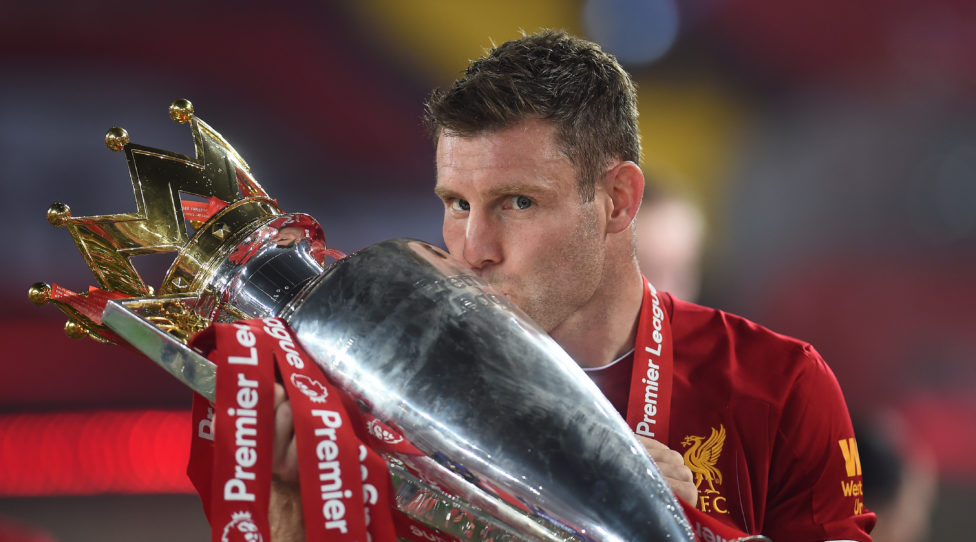 LIVERPOOL, ENGLAND - JULY 22: James Milner of Liverpool kisses the trophy to celebrate winning the League Title during the presentation ceremony of  the Premier League match between Liverpool FC and Chelsea FC at Anfield on July 22, 2020 in Liverpool, England. Football Stadiums around Europe remain empty due to the Coronavirus Pandemic as Government social distancing laws prohibit fans inside venues resulting in games being played behind closed doors. (Photo by Laurence Griffiths/Getty Images)