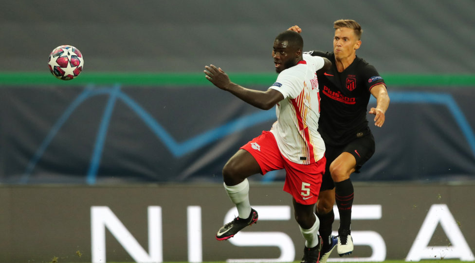 LISBON, PORTUGAL - AUGUST 13: Dayot Upamecano of RB Leipzig is challenged by Marcos Llorente of Atletico de Madrid during the UEFA Champions League Quarter Final match between RB Leipzig and Club Atletico de Madrid at Estadio Jose Alvalade on August 13, 2020 in Lisbon, Portugal. (Photo by Miguel A. Lopes/Pool via Getty Images)