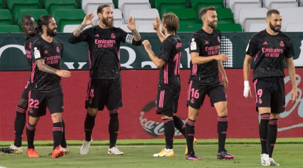 Real Madrid's Spanish defender Sergio Ramos (3L) celebrates with teammates after scoring during the Spanish league football match Real Betis against Real Madrid CF at the Benito Villamarin stadium in Seville on September 26, 2020. (Photo by JORGE GUERRERO / AFP) (Photo by JORGE GUERRERO/AFP via Getty Images)