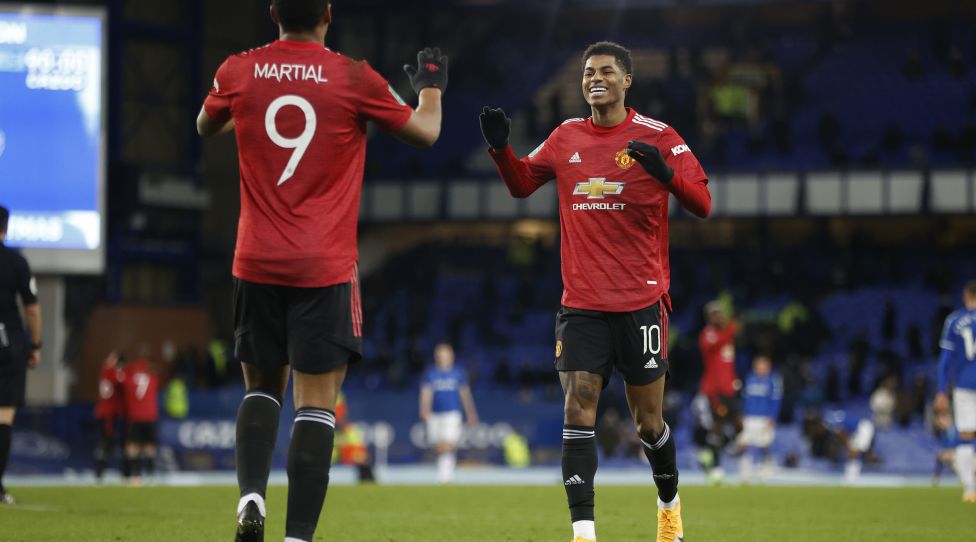 LIVERPOOL, ENGLAND - DECEMBER 23: Anthony Martial of Manchester United (L) celebrates with teammate Marcus Rashford (R) after scoring their team's second goal during the Carabao Cup Quarter Final match between Everton and Manchester United at Goodison Park on December 23, 2020 in Liverpool, England.  A limited number of fans (2000) are welcomed back to stadiums to watch elite football across England. This was following easing of restrictions on spectators in tiers one and two areas only. (Photo by Clive Brunskill/Getty Images)