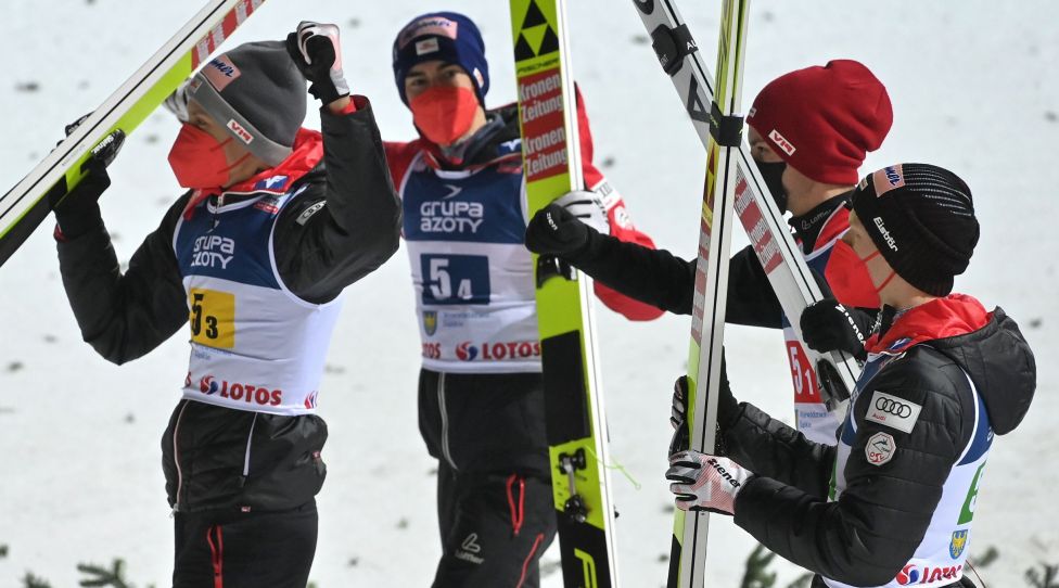 WISLA,POLAND,04.DEC.21 - NORDIC SKIING, SKI JUMPING - FIS World Cup, large hill, team, men. Image shows the rejoicing of AUT with Daniel Huber, Stefan Kraft, Jan Hoerl and Manuel Fettner (AUT). Photo: GEPA pictures/ Wrofoto/ Piotr Hawalej - ATTENTION - NO USAGE RIGHTS FOR POLISH CLIENTS