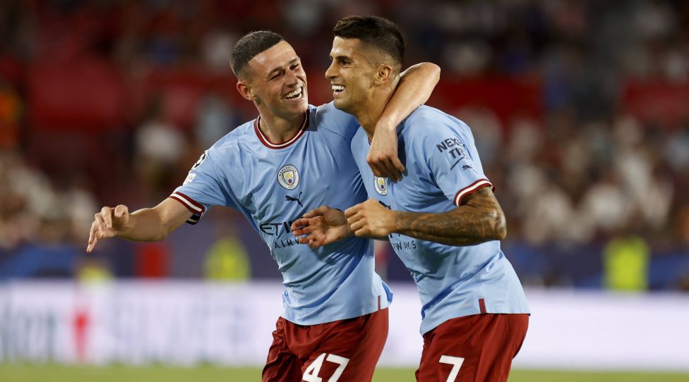 September 6, 2022, Seville, Spain: PHIL FODEN of Manchester City L celebrates after scoring 0-2 with JOAO CANCELO of Manchester City R during the UEFA Champions League Group G soccer match between Sevilla FC and Manchester City at Estadio Ramon Sanchez Pizjuan Seville Spain - ZUMAa142 20220906_zap_a142_019 Copyright: xDanielxGonzalezxAcunax