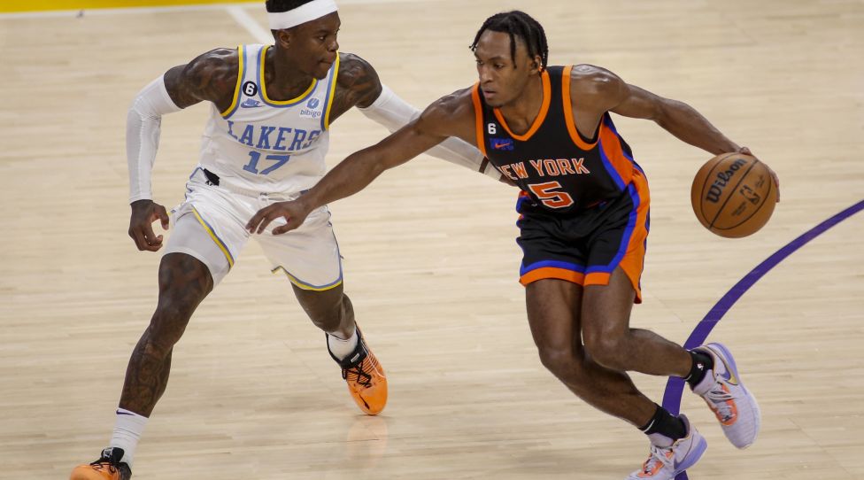 March 12, 2023, Los Angeles, California, United States: New York Knicks guard Immanuel Quckley R drives against Los Angeles Lakers guard Dennis Schroder L during an NBA, Basketball Herren, USA basketball game at Crypto.com Arena. New York Knicks beat Los Angeles Lakers 112-108 Los Angeles United States - ZUMAs197 20230312_zaa_s197_584 Copyright: xRingoxChiux